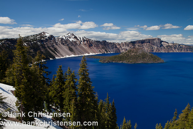 Mount Mazama exploded nearly 8,000 years ago, creating an eruption 100 times larger than Mount St. Helens in 1980.  The mountain's summit collapsed, forming a caldera 6 miles in diameter.  Over time, rain water and snow melt filled the chasm, creating one of the 10 deepest lakes in the world.