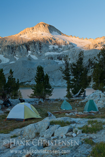 The first rays of sunlight greet a backcountry campsite at Glacier Lake, Eagle Cap Wilderness, Oregon