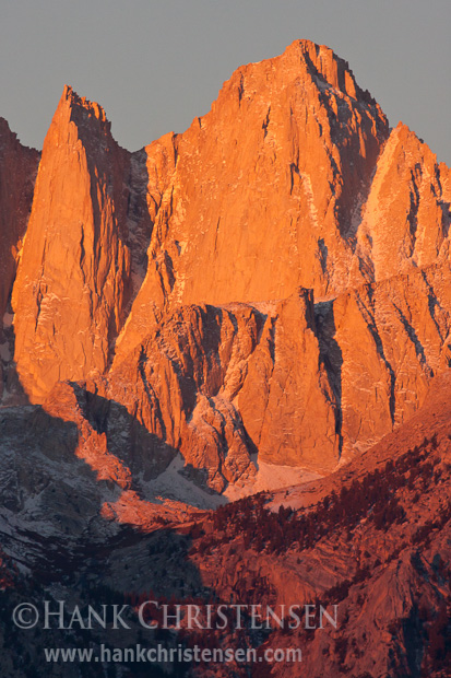 Alpenglow on Mt. Whitney Light from the rising sun creeps down the face of Mt. Whitney at dawn, Alabama Hills, CA