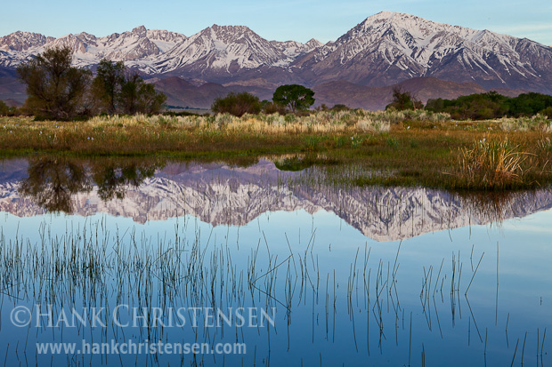 The rising sun lightly dusts the peaks of the Eastern Sierra, Bishop, CA.