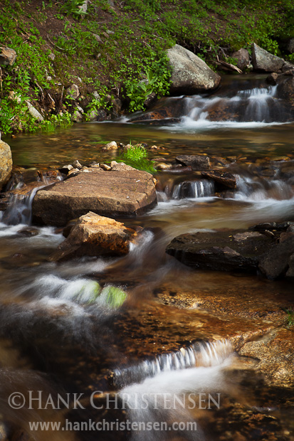 A stream runs between two lakes in the Ten Lakes chain, forming a small cascade, Yosemite National Park