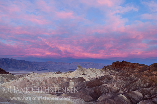 The sky turns pink at first light at Zabriskie Point, Death Valley National Park