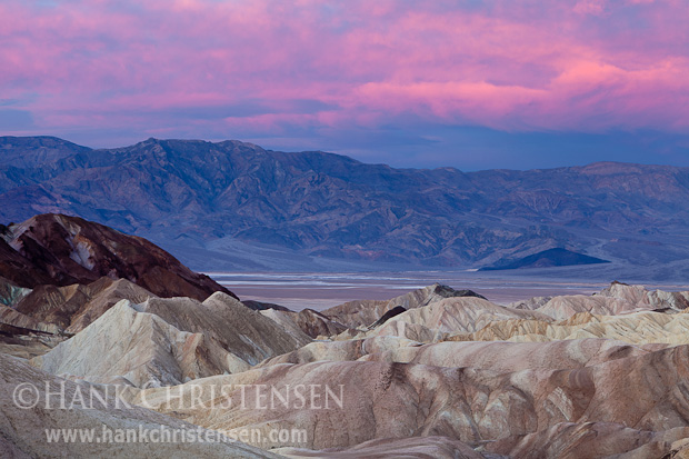 Dawn light permeates the clouds at Zabriskie Point, Death Valley National Park