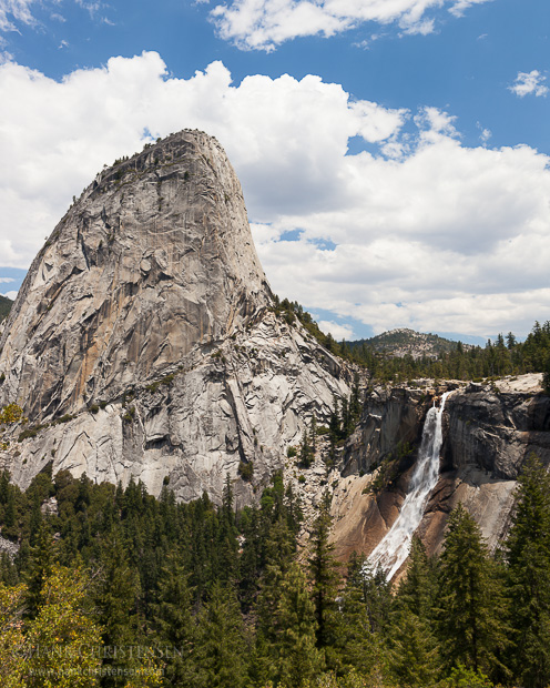 Liberty Cap looms above Nevada Falls, showing mid summer flow