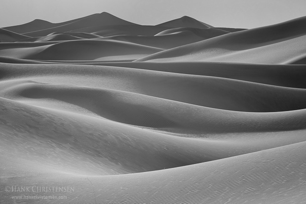 Soft light across the dunes adds a milky texture to the wind carved lines, Death Valley National Park