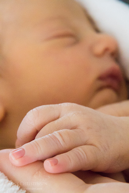 Jake Jr sleep soundly while resting his hand in his mother's