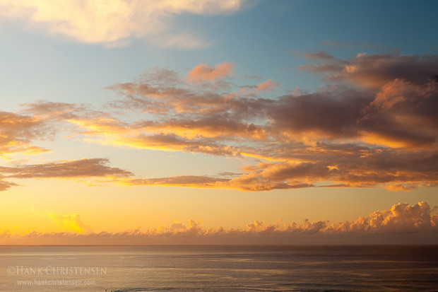 Clouds billow over the water at sunset, Kauai, Hawaii