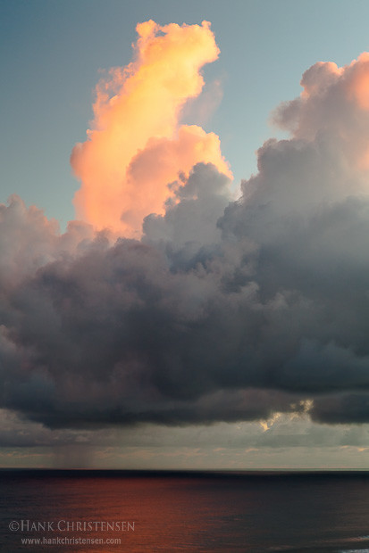 Clouds billow over the water at sunset, Kauai, Hawaii